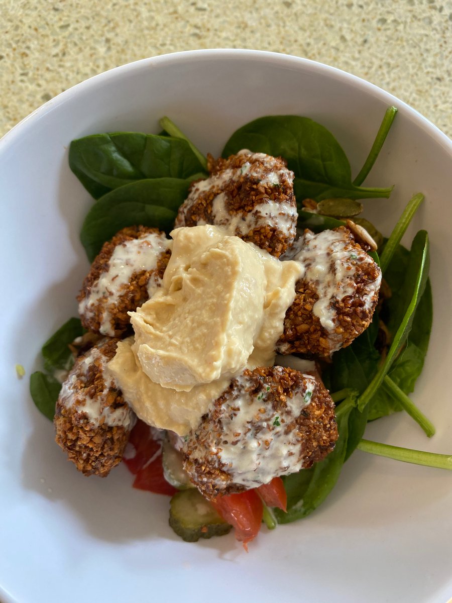 Air fryer falafel with hummus, tahini sauce, seed salad topper, tomato, pickles, and baby spinach #vegan