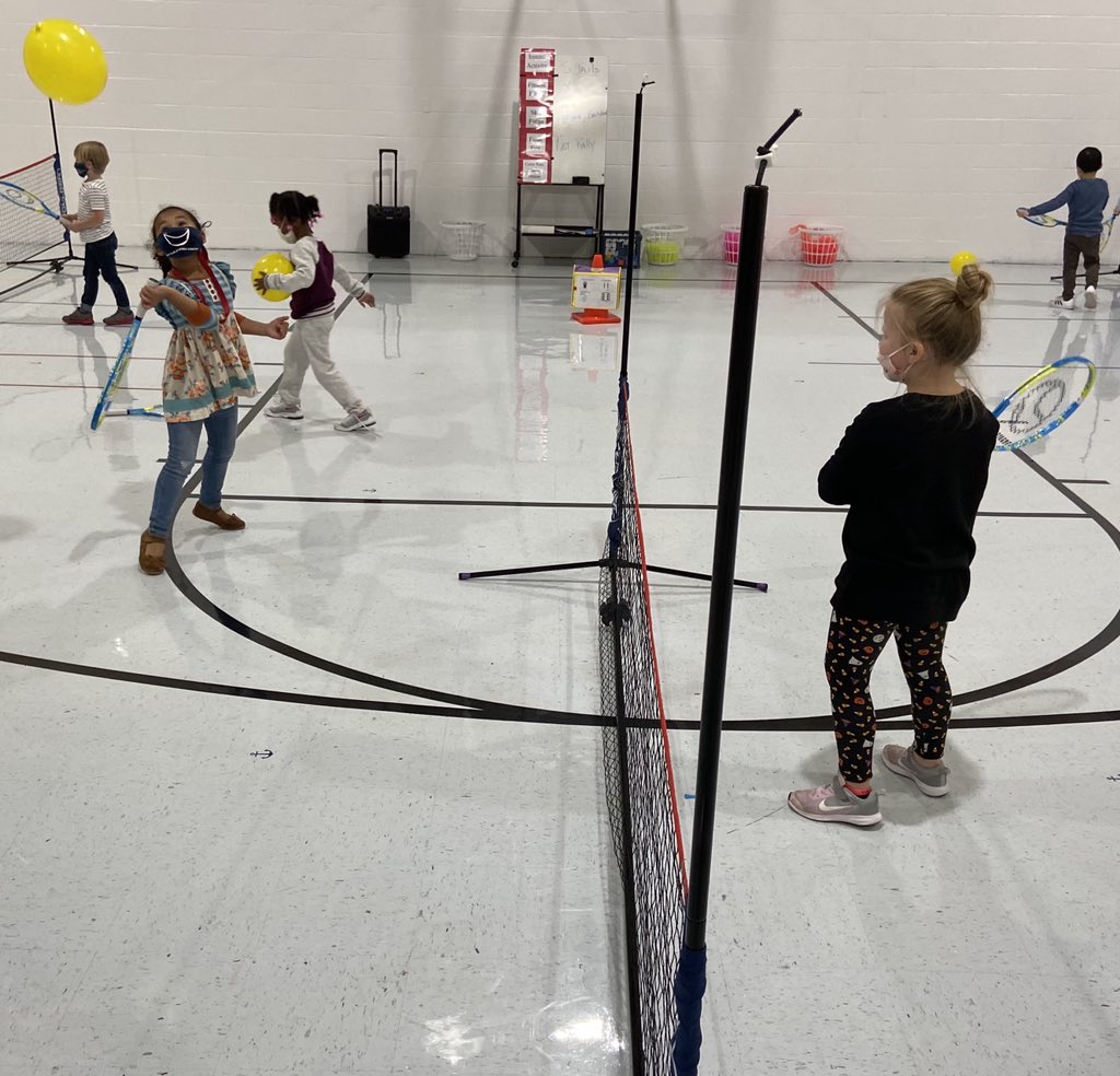 Tennis anyone? K students learning the basics in PE class!