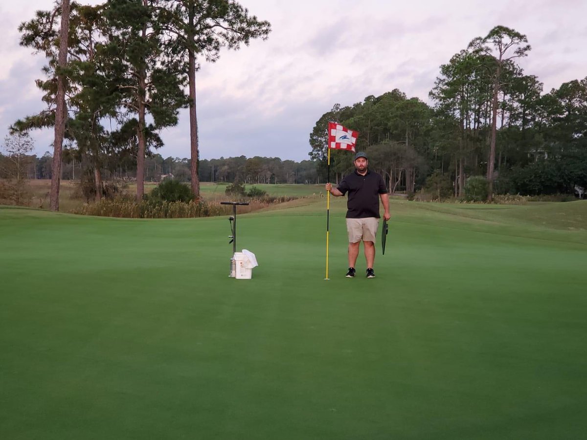 Chad Brannon of our maintenance crew changing cups and hand watering greens ahead of play this morning! #OspreyCove