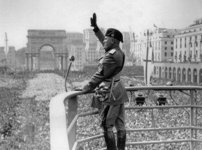 What defined Fascism?Nationalism: restore Italy’s greatness, recover mythic Roman past.Corporatism: workers, business, govt join together to toil for the nation. No class struggle!Anti-Communism: we like private property!A cult of personality around *Il Duce* (the leader).
