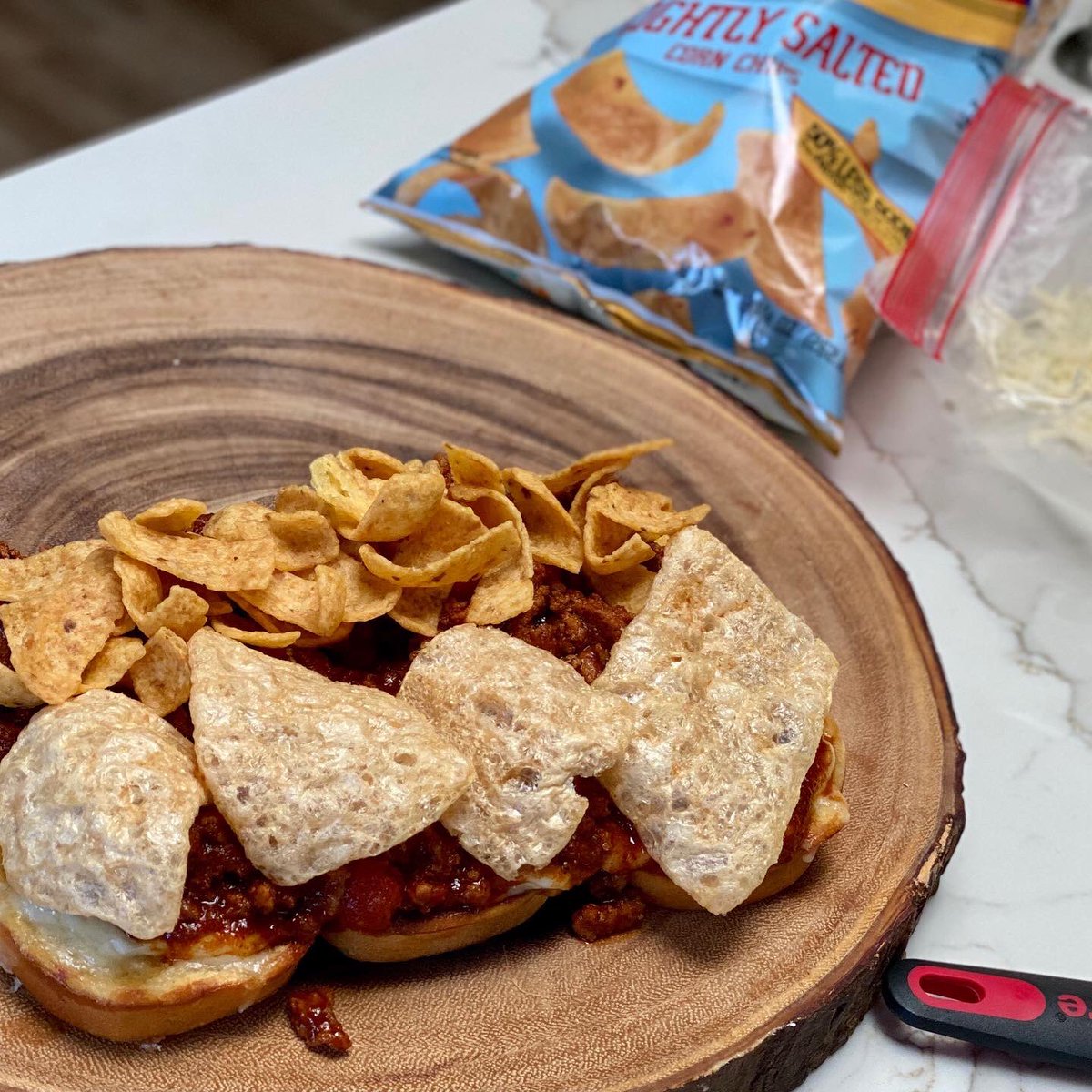 FiveMonkeysBBQ's tweet photo. A favorite at #5MHQ 🤣😍. 5M sloppy Carl’s: fresh ground beef, spices, @rotel diced tomatoes, #5MOC, slider potato buns, fresh shredded white sharp cheddar, Fritos,  chicharrones, salt crusted baked potato, roasted purple cauliflower seasoned with Fix All, evoo and Parmesan https://t.co/tLrMmOm1gV