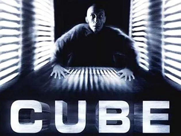 Cube:There's a proud tradition of low budget Canadian cinema that stretches a whole movie out of one set, and Cube is one of the best-known examples of that. Group of people trapped in a deathmaze of cube-shaped rooms, some filled with traps, shuffling and rearranging every hour