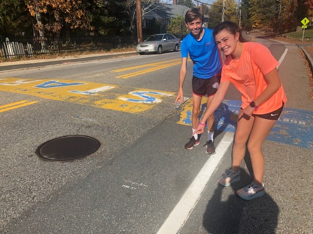 She then noticed the fading Boston Marathon start line. I told her that for more 30 years, our DMSE colleague, Jack Leduc, painted the start line but retired from doing so in 2018. She then noticed another faded painted logo on the road next to the start line.