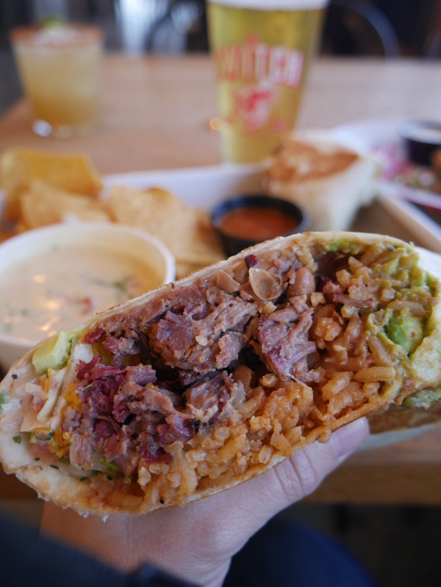 theswitchbbq's tweet photo. #Thursday with the Brisket Burrito special. Table Chopped Brisket, Spanish Rice, Brisket Pintos, guacamole rolled up fat...served w a side of our house Salsa &amp; Chile Con Queso and Chips. Get on by &amp; Grab a #Margarita w that Burrito. @TexasMonthly #TMBBQWeek Continues. #ATX #BBQ https://t.co/fpLgYpvugR