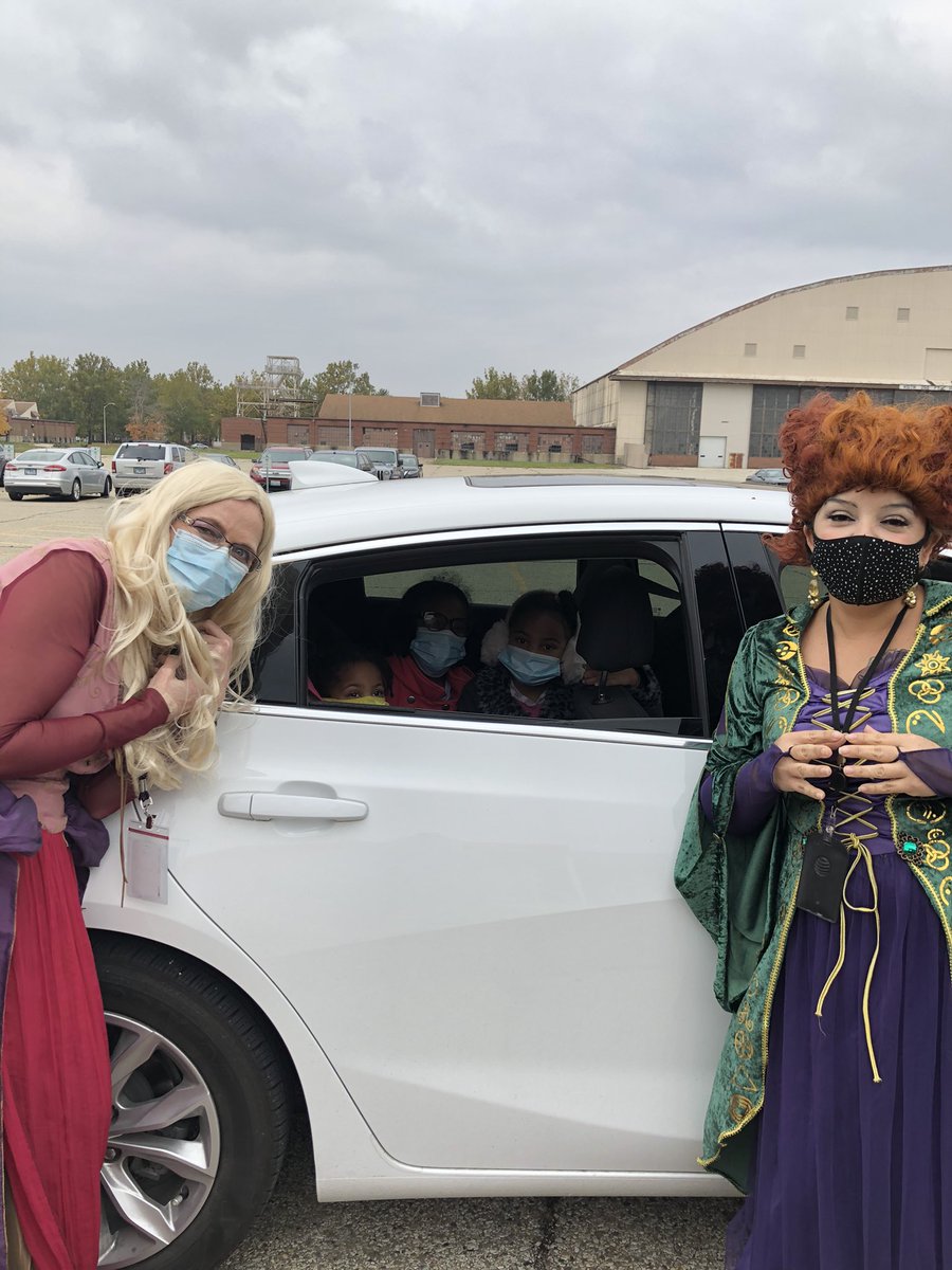 Having fun handing out candy COVID style.