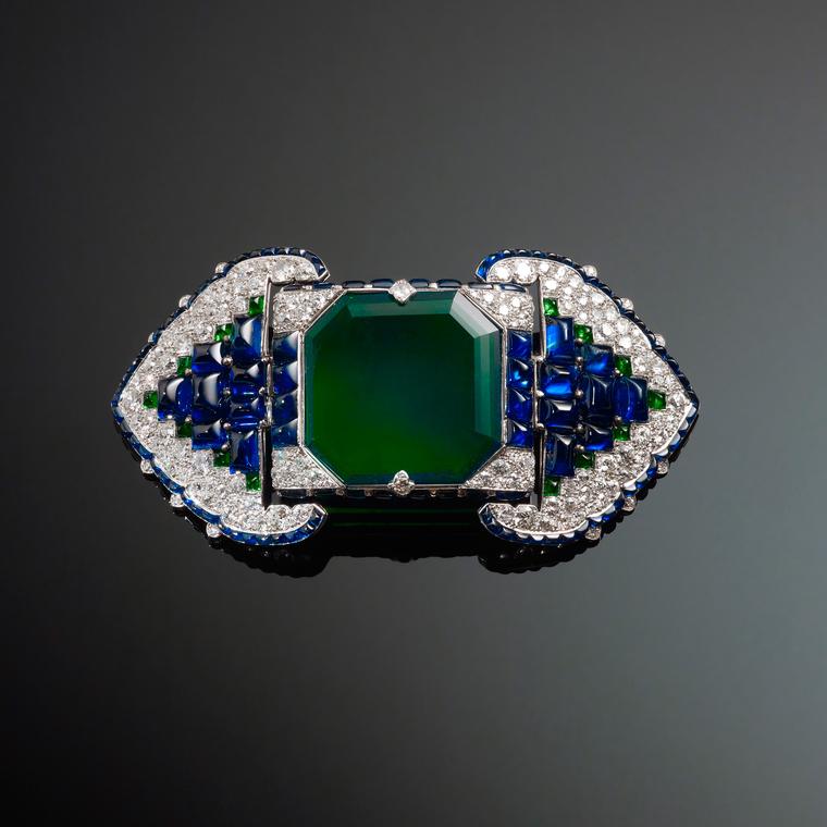 Back when Cartier was good, an art-deco clip/brooch, with sapphires and I think an emerald. The color shift... I'm not sure. But probabl an emerald.