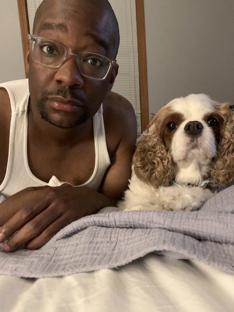 Now I talk to this dog via FaceTime. I carry this dog around like a baby. I have a whole ass album full of Sammy pics. And I even pose with this dog.