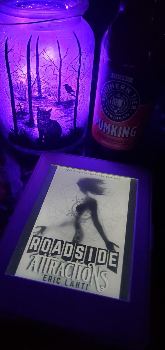 Carrie_D_Miller's tweet photo. Finally a relaxing evening! Reading a long-awaited novel from @ericlahti by purple light with an excellent beer from @stbcbeer.
#readtoescape #readtorelax #halloween #roadsideattractions #pumpkingbeer https://t.co/H9xhujzhUG