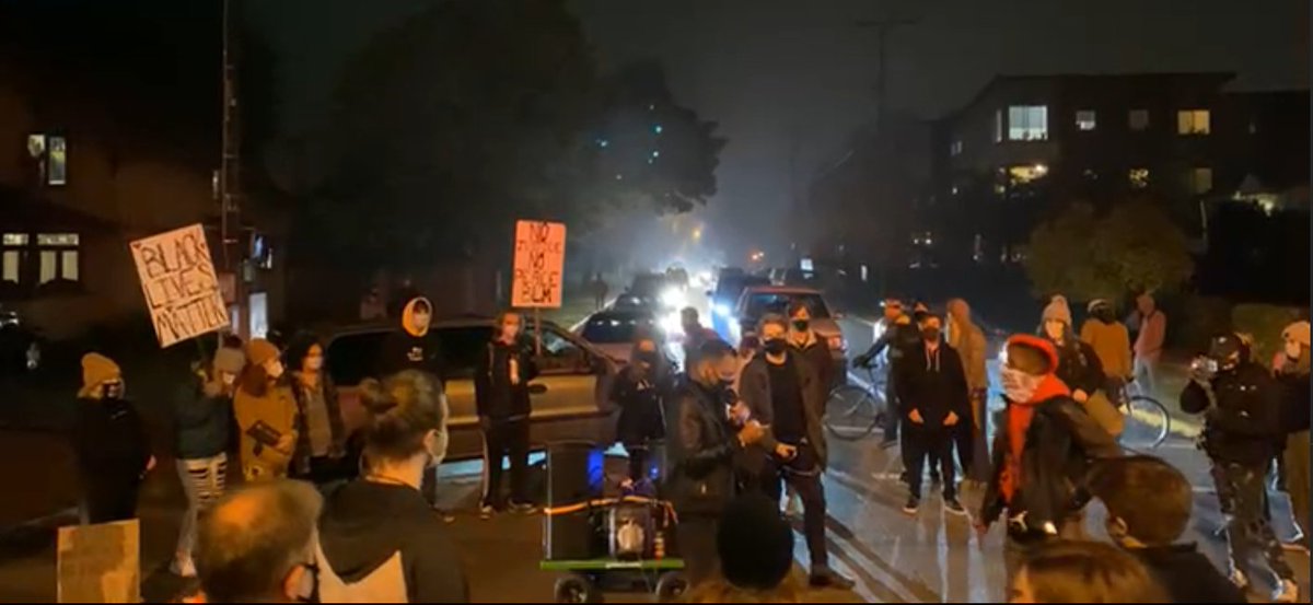 MNMissy's tweet image. Eugene college protesters blocked traffic for about 20 minutes or so.  These are non-violent citizens who conduct respectful protests daily.  #BLM #peacefulprotesters #BlackLivesMatter #BlackUnity