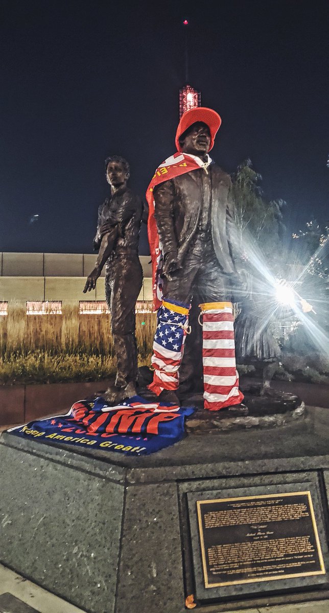 Over by the Convention Center, chuds have disrespectful redecorated the MLK statue with Trump gear.