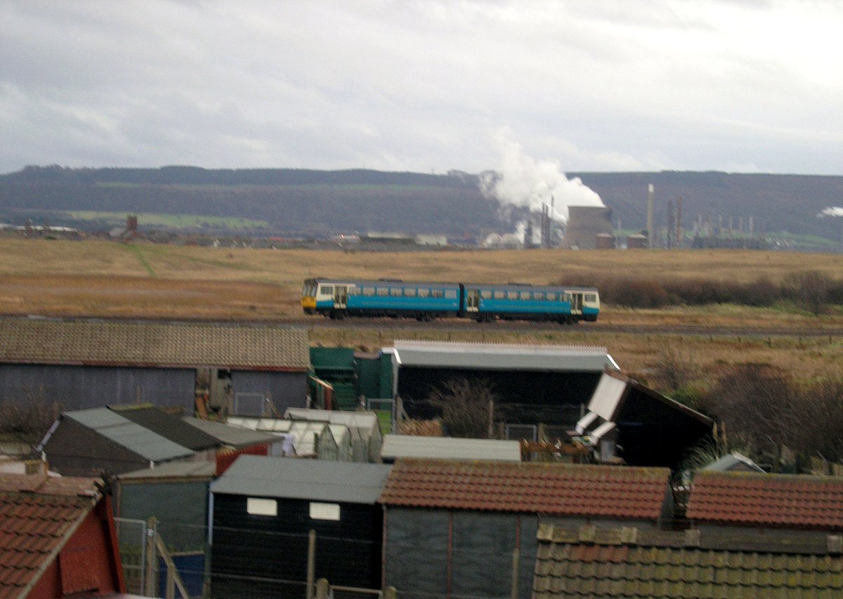 Ranaroth2's tweet image. Unidentified 142. Steelworks in background. Photo: Redcar, 17.01.2005. #railway #DMU #Class142 #railbus #Redcar @SalopianLyne