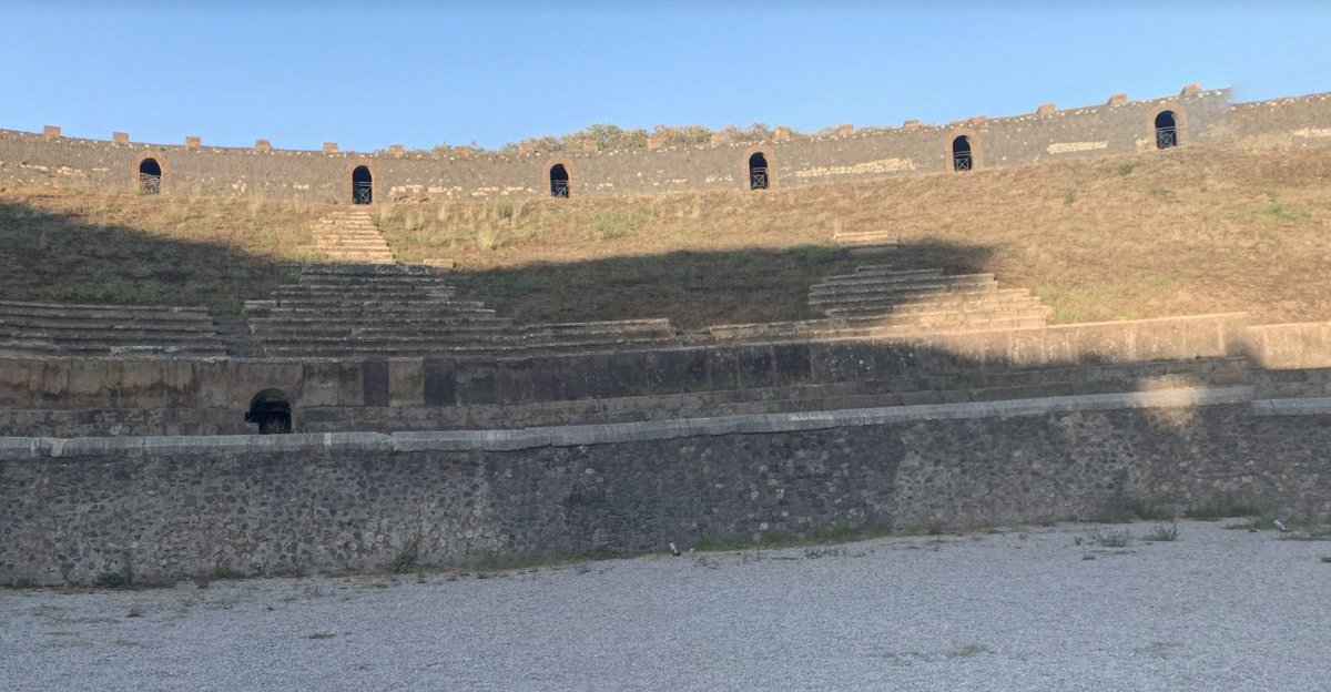 Many of the seats are covered in grass, but some are still visible. The main structure of the theater looks almost completely intact. Using Google Earth, I was also able to get a sense of its location in relation to the rest of Pompeii. /2