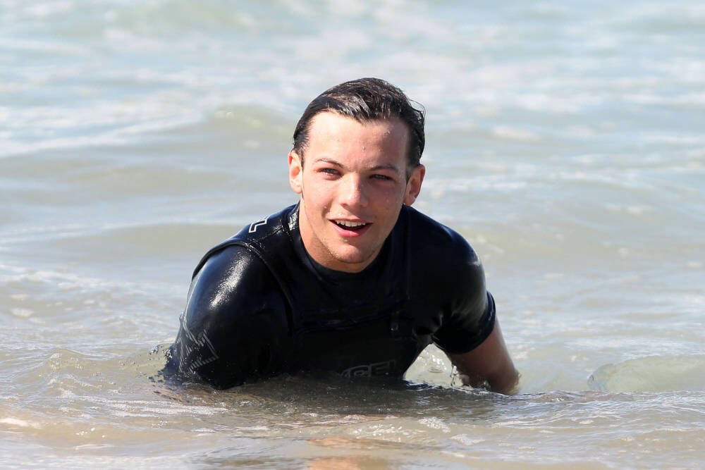 louis tomlinson with wet hair; a thread