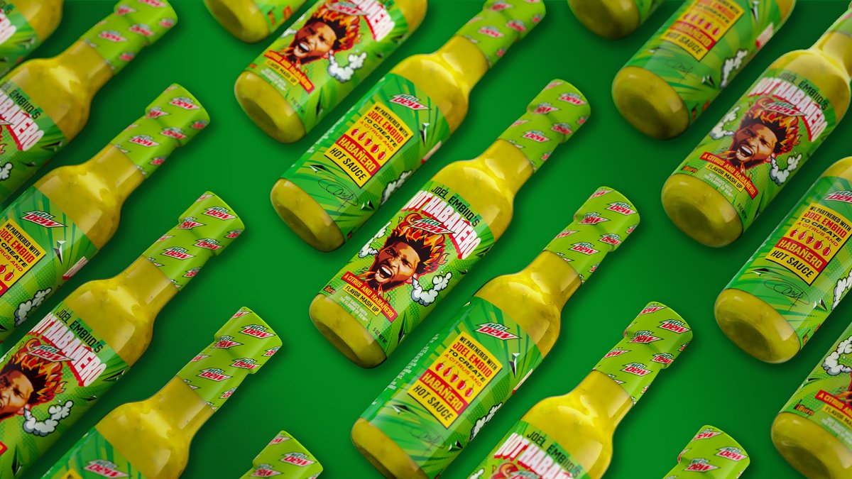 MountainDew's tweet photo. It’s time for the 🔥 🔥 🔥 Meet the first-ever #MTNDEWHotSauce, created by @iBurn under the watchful eye of @JoelEmbiid. Want DEW over everything? This has the distinct citrus flavor that DEW fans know and love, but spicier 🌶️. Tell us, what would you put it on?? https://t.co/cplqptg8ZD