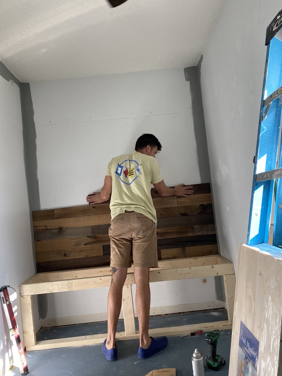 Bench storage framed out. Stained shiplap going up.