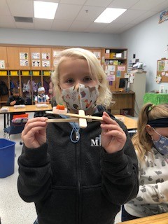 MTCESK8's tweet photo. There are some budding engineers in Mrs. Frame's first grade class. They have been working hard on designing and building small catapults using plastic lids, wooden sticks, and rubber bands. They used them to launch candy pumpkins. #mtcesSTEAM #HalloweenIsComing https://t.co/saBWXhkV1K