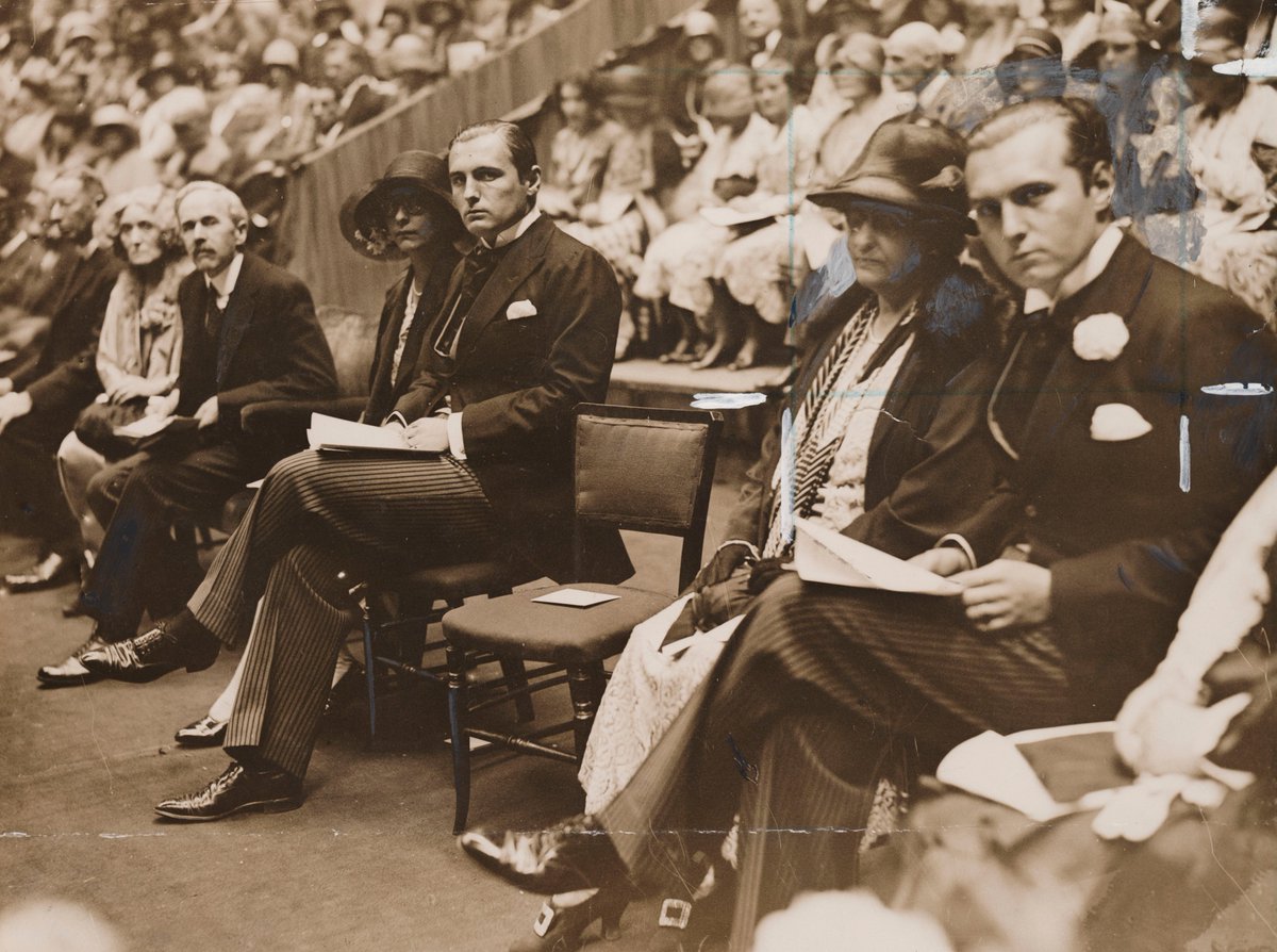 After Sir Arthur Conan Doyle died, a mass séance was held at the Royal Albert Hall. This image from the Daily Herald Archive shows an empty seat left for Conan Doyle at the séance.