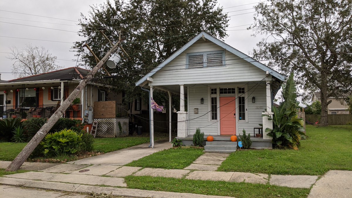 thatgibbyguy's tweet photo. Hey @EntergyNOLA , your lines are down and resting on these peoples' homes, and you haven't even sent and assessment crew. This is at Trafalgar &amp; N. Rendon across from an elementary school. Kids play here, when are you going to do something? https://t.co/ncP48Z25KZ