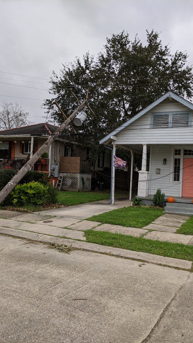 thatgibbyguy's tweet photo. Hey @EntergyNOLA , your lines are down and resting on these peoples' homes, and you haven't even sent and assessment crew. This is at Trafalgar &amp; N. Rendon across from an elementary school. Kids play here, when are you going to do something? https://t.co/ncP48Z25KZ