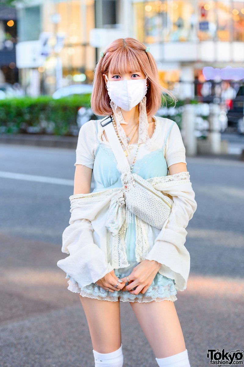 Japanese fashion designer Akino - her brand is Parca Silky - on the street  in Harajuku wearing a pastel look with pink hair, vintage and antique lace  and lingerie, and baby doll, image size:800x1200