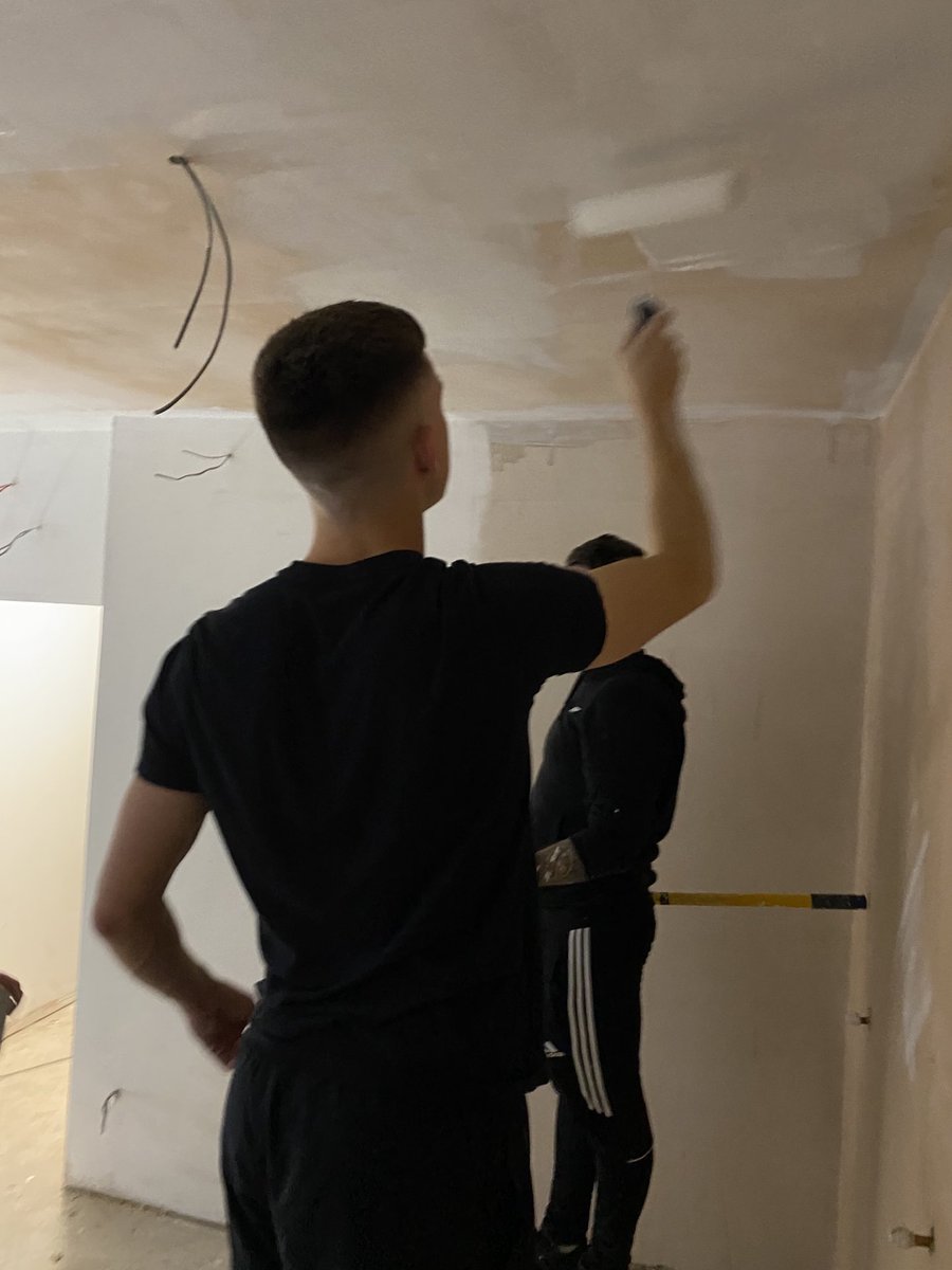 The WAR FC lads painting the changing rooms for the club
