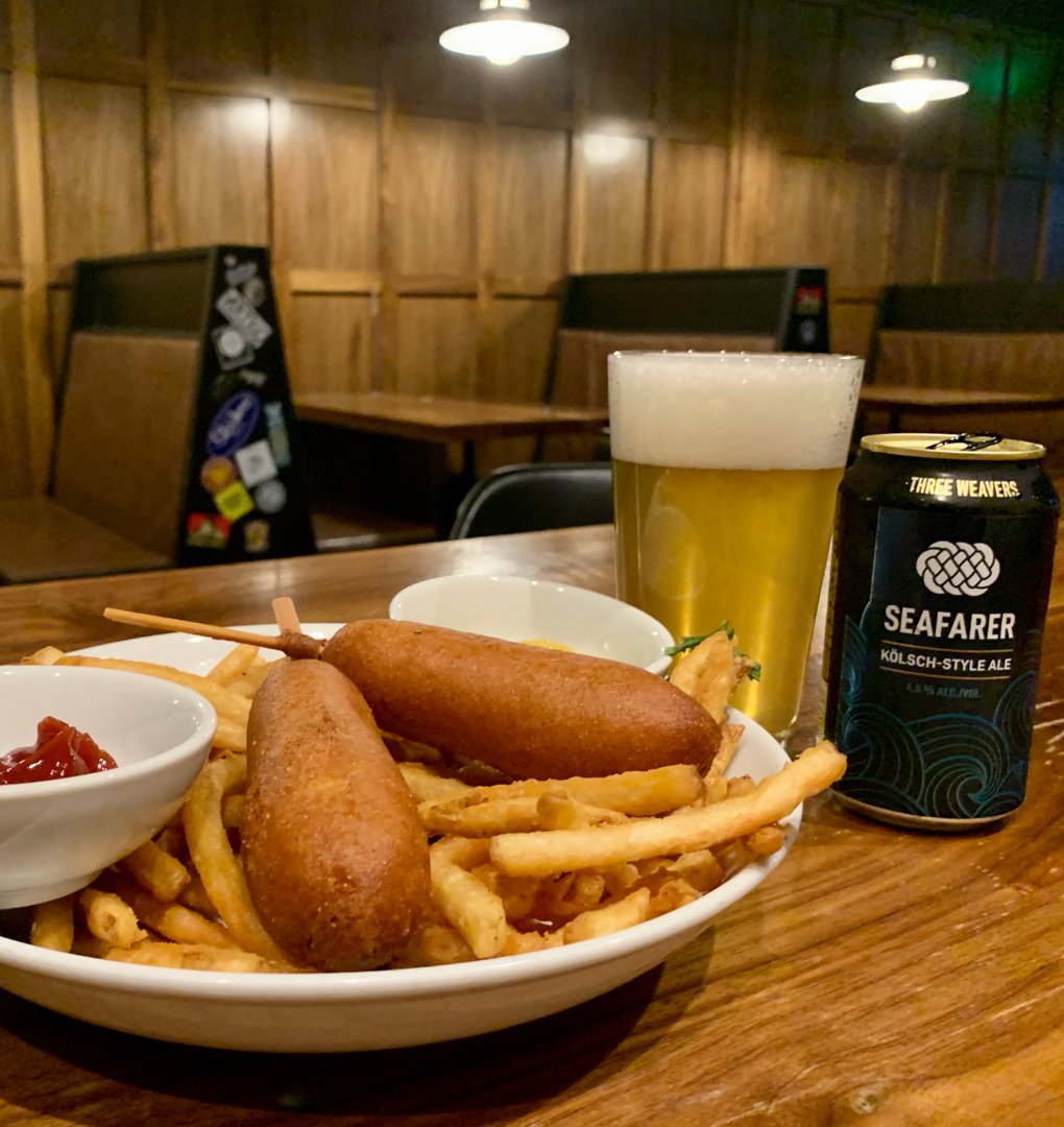 Pub1954's tweet photo. Every corn dog has its day, and today is the day you should try one of our delicious dogs, brought to you by @saturncafe NELA! They pair well with an ice-cold beer from @ThreeWeavers Come out and join us for al fresco dining on our patio! #Pub1954 #PieAndCone https://t.co/oGOEjvibSn