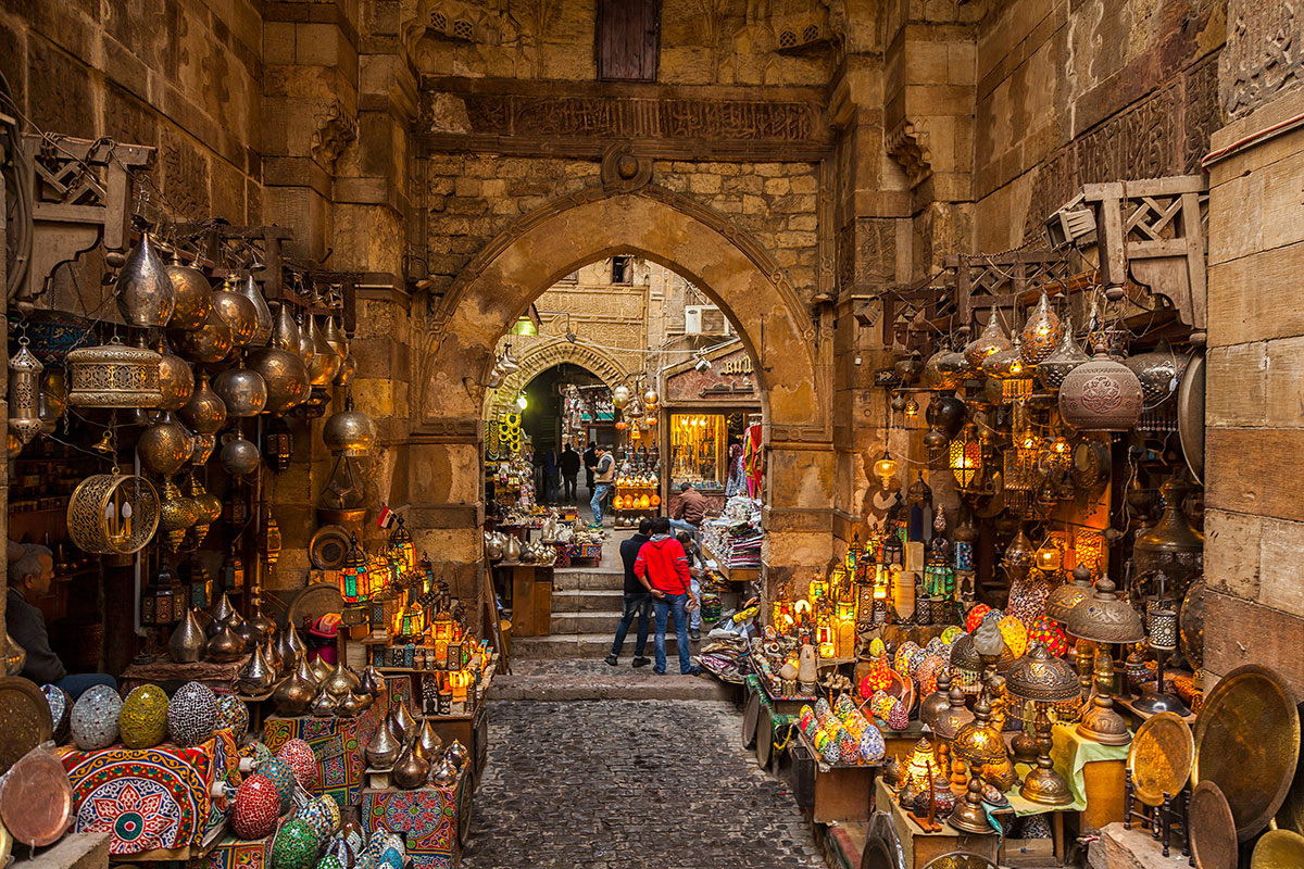 Court8518's tweet photo. Cairo Egypt is an old city, with beautiful buildings and lots of lights and colors in the markets! The building while mostly brown, places with color are beautiful! I can’t wait to shop the markets and explore the town! #Cairo #Travel #Egypt https://t.co/hoAv8HtAgb