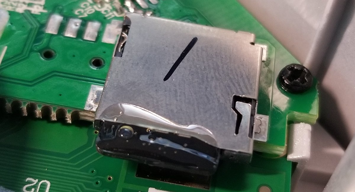 Yeah, that's a microSD card glued into a socket.