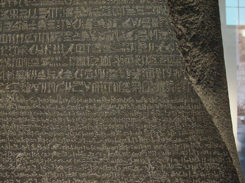 The Rosetta Stone is the remnant of a large stone slab, called a stele. Carved into the stone is an identical message, written three times in three different ancient writing systems: demotic, ancient Greek, and Egyptian hieroglyphics.