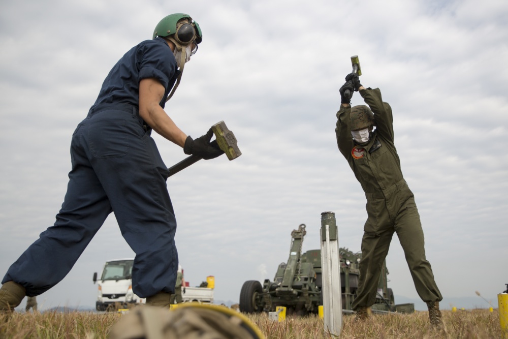 INDOPACOM's tweet photo. .@PacificMarines install supports for M-31 expeditionary aircraft arresting gear during exercise #ActiveShield aboard Marine Corps Air Station Iwakuni, Japan. #FreeandOpenIndoPacific https://t.co/aiJ7CJV2QP