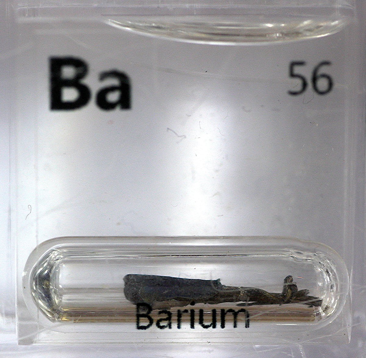 Barium  #elementphotos. White compound is barium carbonate (BaCO3), while the black pellet is a 123 superconductor (YBa2Cu3O7-x) with a critical temperature of 95 K.