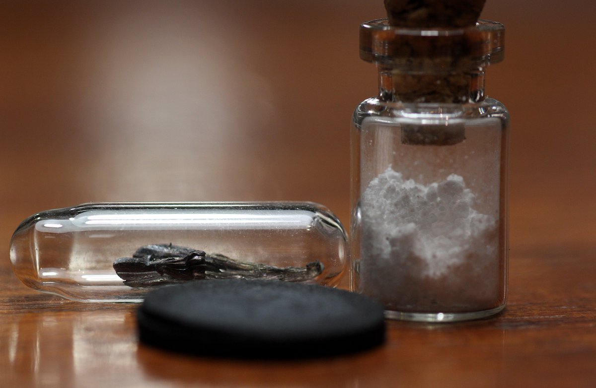 Barium  #elementphotos. White compound is barium carbonate (BaCO3), while the black pellet is a 123 superconductor (YBa2Cu3O7-x) with a critical temperature of 95 K.