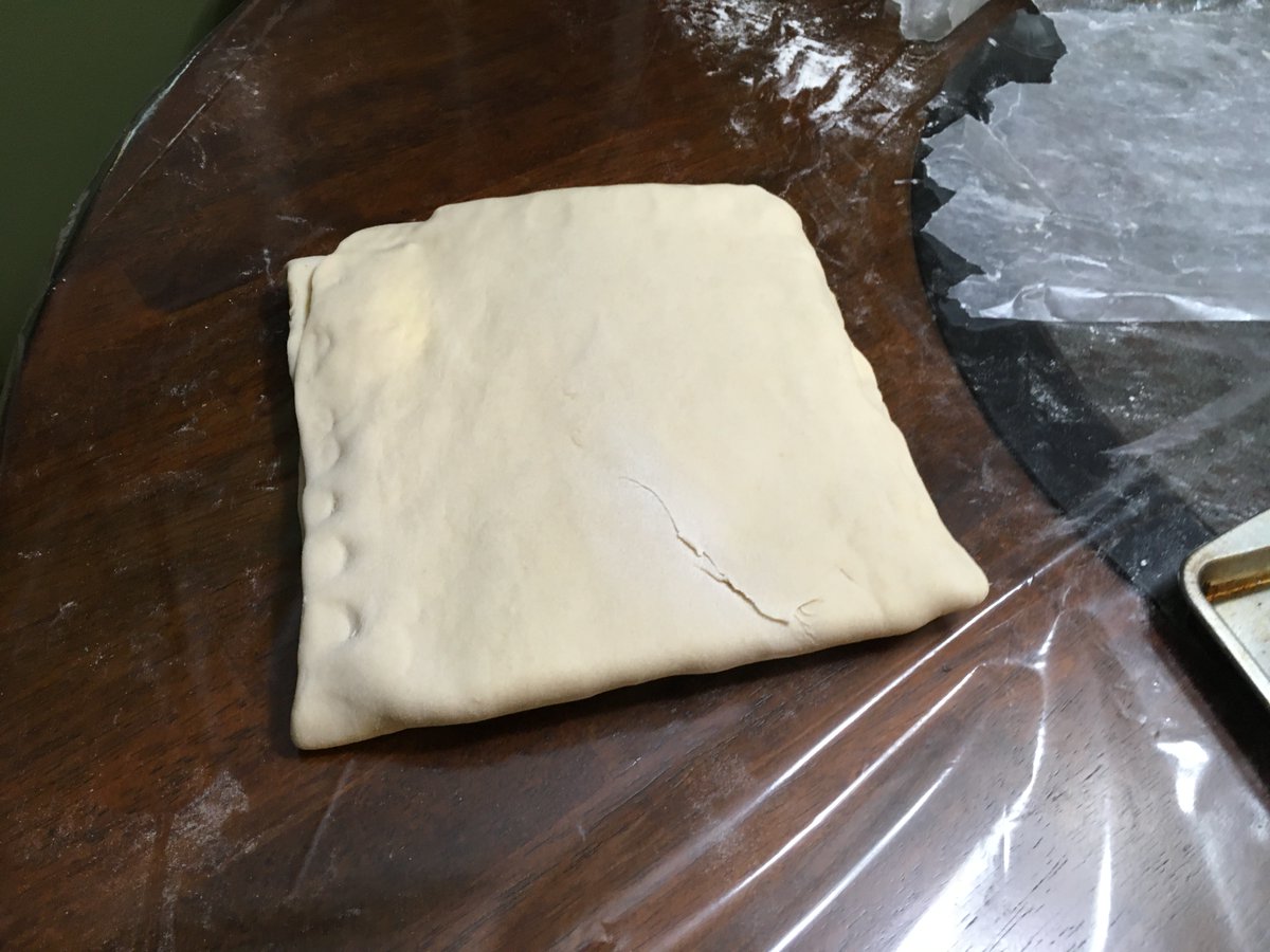 picture of croissant dough after 1 turn, with edges crimped shut