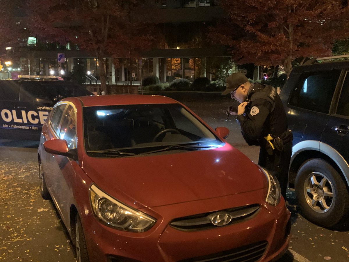Cops searching vehicles and taking down vin numbers
