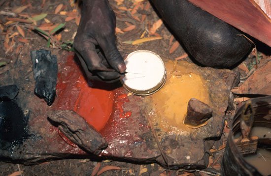 Ochre, traditionally used by Aboriginal Australian peoples to decorate objects, to create art, and in body decoration and a Rock painting of a lizardlike creature, Hawker, South Australia.