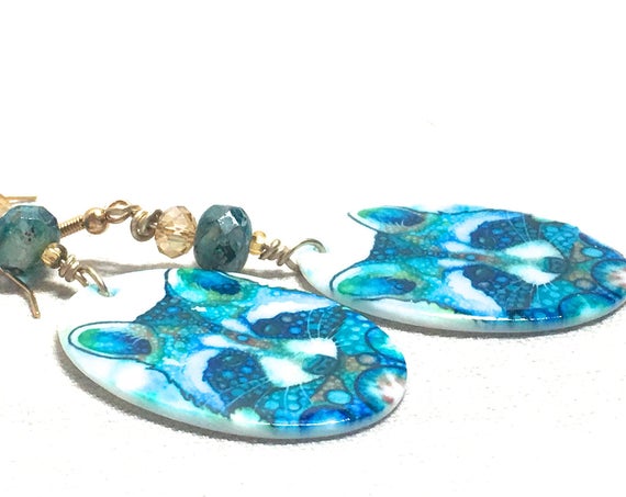 ZenCatPottery's tweet photo. Watercolor Raccoon Earrings, blue https://t.co/WhJHdOkNhG via @EtsySocial #zencatpottery #etsyseller #bluetealturquoise #Czechcrystal https://t.co/vIShHE3mhQ