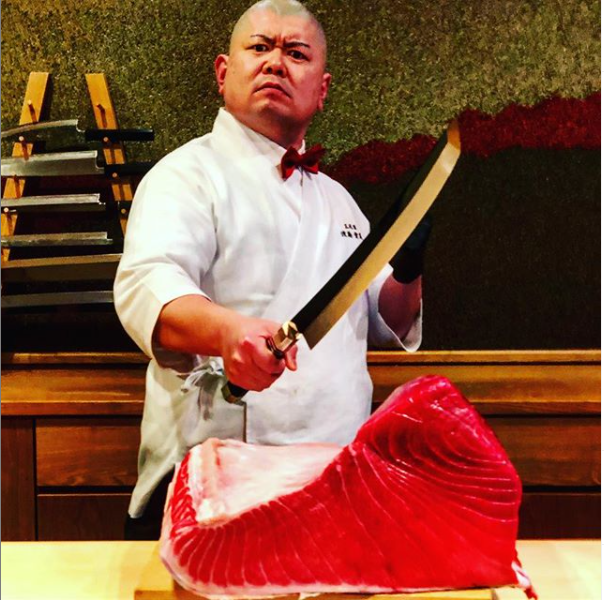 Sidenote: I fucking love how he uses an actual samurai katana to cut his fish while wearing a bright red bowtie it's so over the top and completely ridiculous