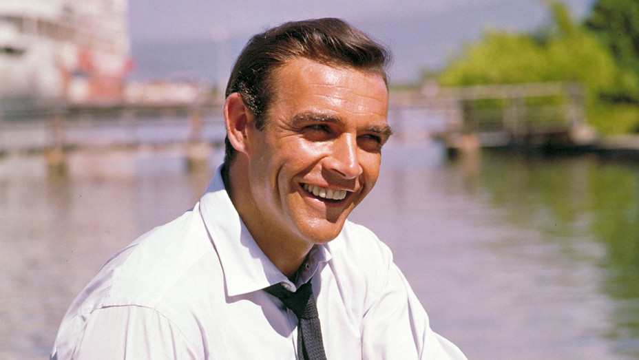 "He revolutionized the world with his gritty and witty portrayal of the sexy and charismatic secret agent," James Bond producers Michael G. Wilson and Barbara Broccoli say of Sean Connery thr.cm/4gXLLOB