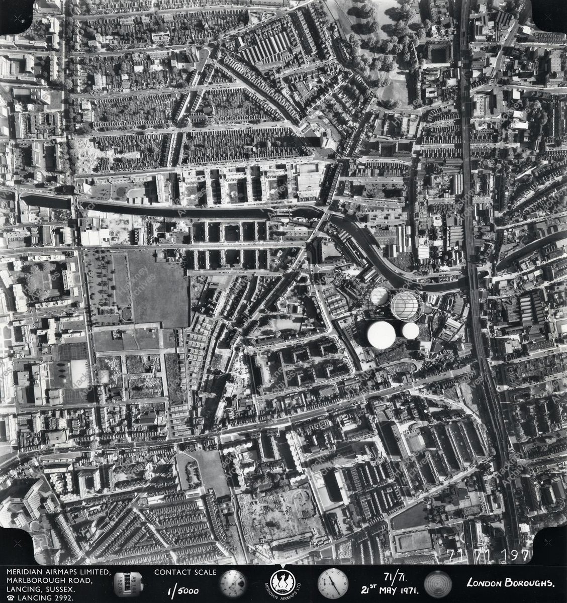 Here's a view from the air in 1971 showing Haggerston Park, a bit of London Fields the gasholders of Marian Place the canal and railway line. What is noticeable is just how spartan the park looks.