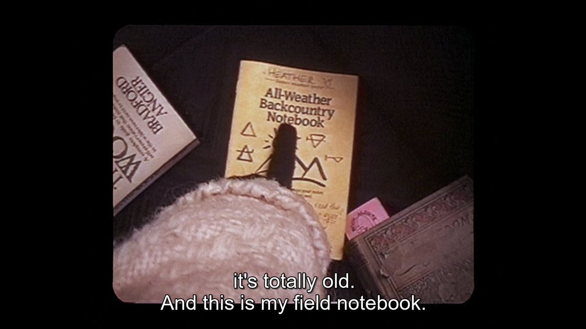 every book heather brings along with her is directly important: 'how to stay alive in the woods'; field notebook (with her name written on top, a very sweet touch); the book with the article about coffin rock. she wants to be prepared for exactly enough and no light reading