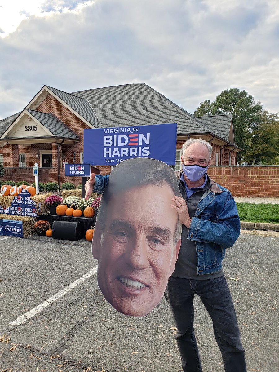 Tim Kaine with a picture of Mark Warner.