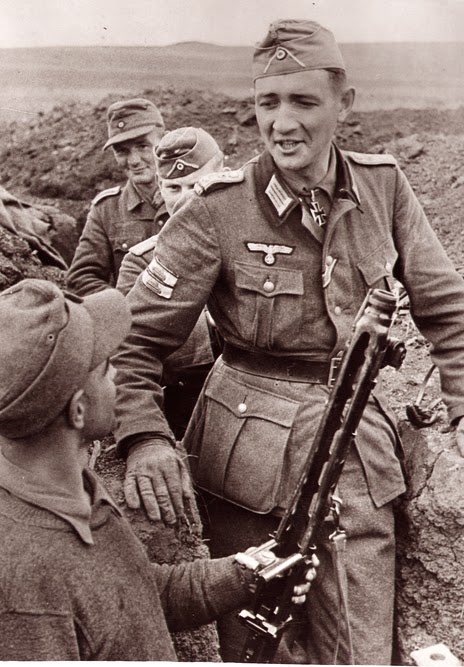 Between the 2 pics we can see Ott is decorated with the Knights Cross, Iron Cross 1st/2nd class & further indication of his close combat experience via the Infantry Assault badge in Silver with 2 Tank Destruction badges.37e)