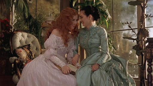 Here's Mina in her living growing green again, while innocently uninnocent Lucy is marked out for death. Her dress is very pretty, but who know where or when it's supposed to be?