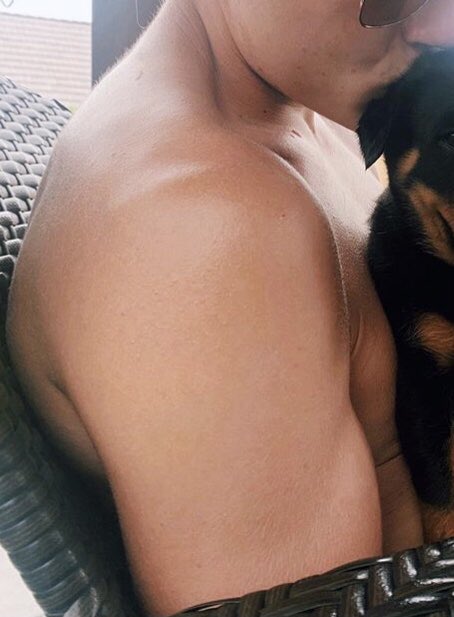 he probably thought the dog was the star of the picture. nope it was his arm