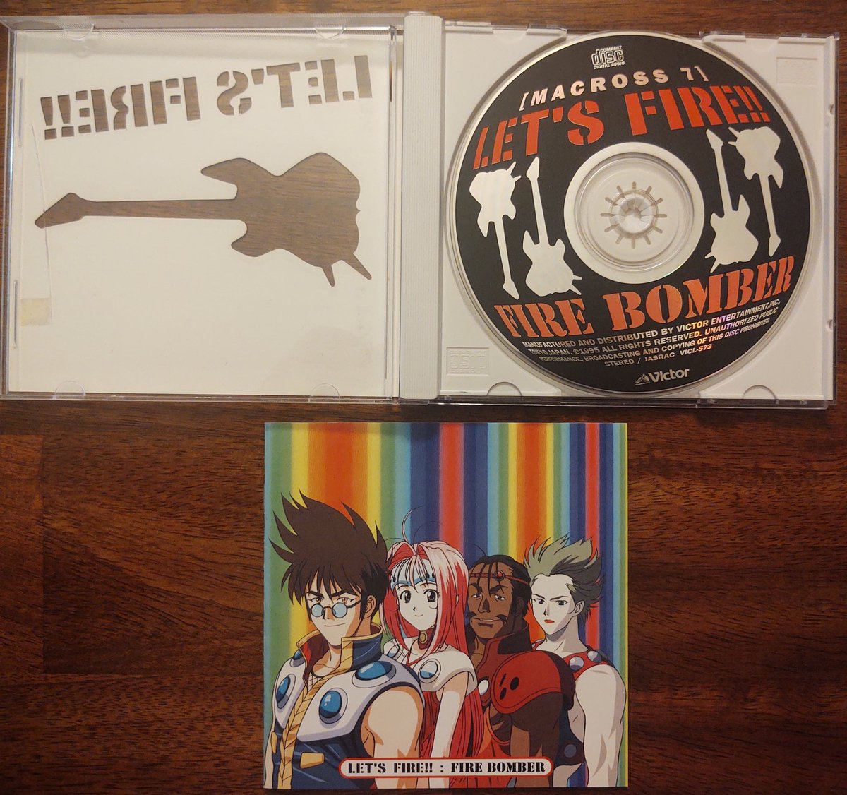 jcaliff's tweet photo. I feel like doing a set of posts about Macross 7 cds. The first Fire Bomber song collection for the TV series was Let's Fire!! It had a cool die cut stencil cover stuck to the outside of the case and included a good selection of songs from the 1st part of the series. https://t.co/sMfQbUSGE8