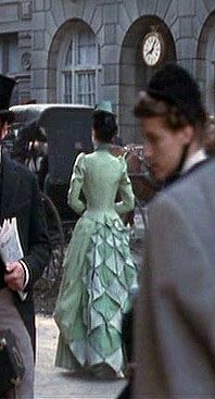 So now we're in a street secene with lots of possiblity for 1897 fashion. And yet, Mina is still back in the late 1880s, maybe 1890. Why draw on so much else flowing sinuous Art Nouveau but then jump back nearly a decade? All the extras are 1880s too.