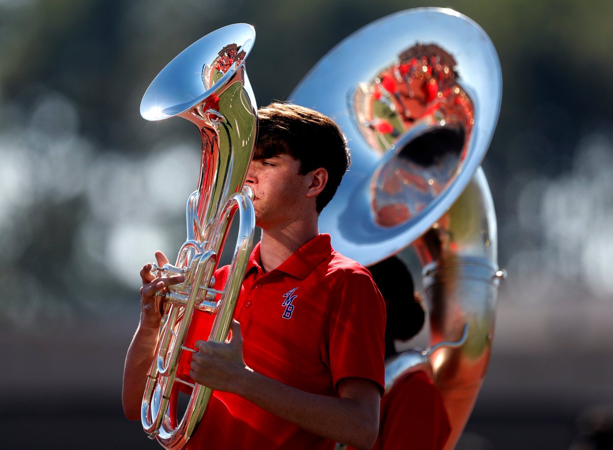 📷: .<a href="/AHS_EagleBand/">AHS Eagle Band</a> baritone player Derek Chabera warms up before halftime of a District 21-6A high school football game at Turner Stadium on Saturday.