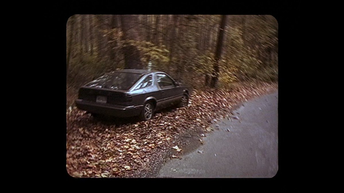 the film almost overplays its hand here—too ominous maybe to keep this constant looking-back towards the Car, which is clearly going to stay there (and in fact was featured heavily as Evidence in curse of the blair witch)—but that's a phenomenal restaging w/ actors walking past