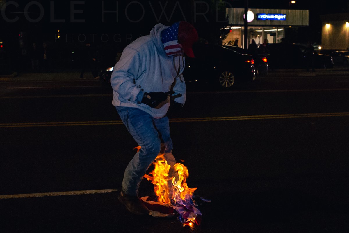 Last night near the candlelight vigil for Kevin Peterson Jr conflict broke out between #BLM & Trump supporters. After a Trump flag & a US flag were lit on fire a trump supporter grabbed the lit flags & tried to put it out almost igniting himself. #portlandprotests #pdxprotests