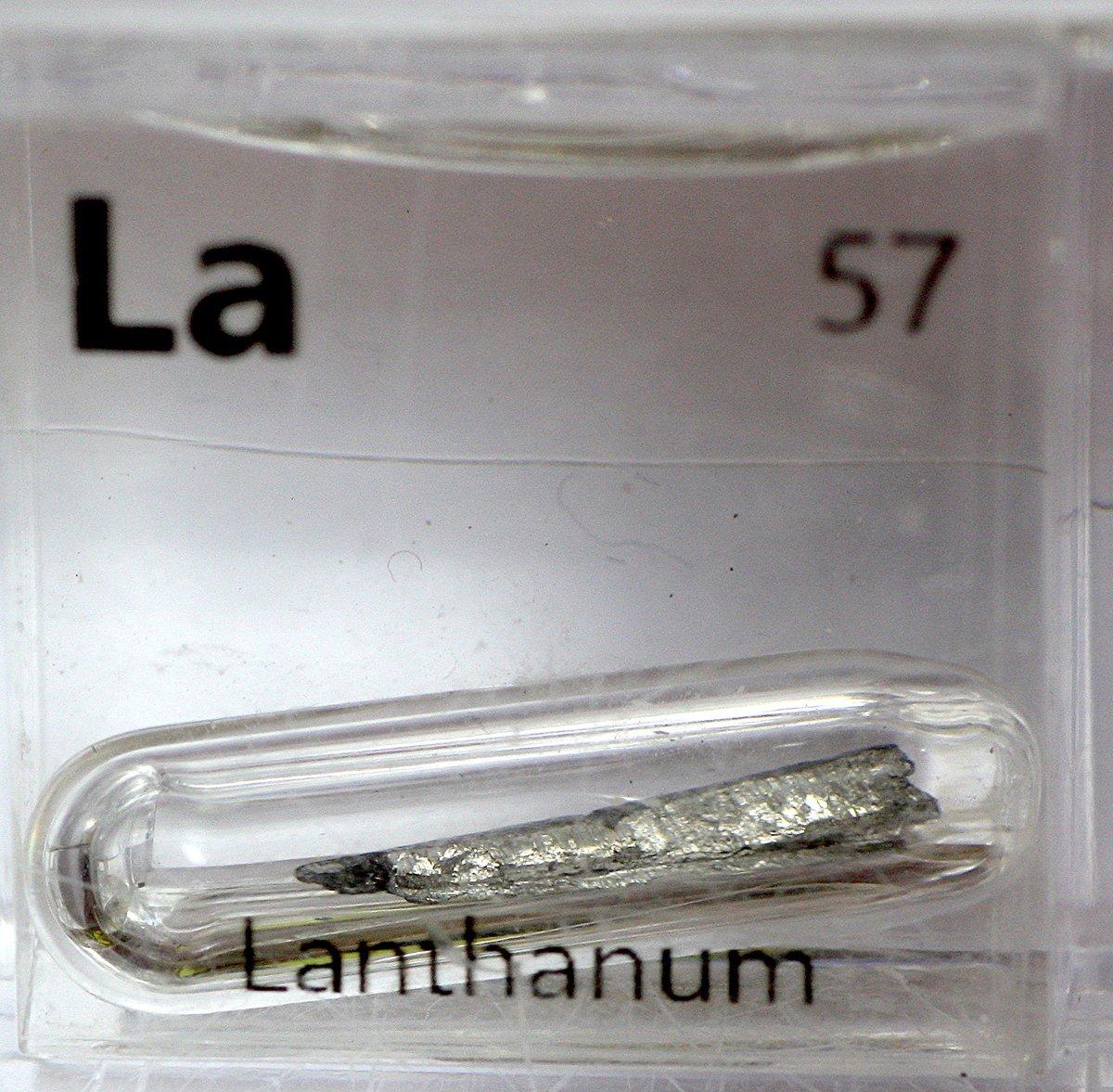 Lanthanum  #elementphotos. Like all the early lanthanoids, it oxidises easily. Though stored here in ampoules under inert atmospheres, oxidation is still apparent on at least one of the samples. White compound is lanthanum nitrate (La(NO3)3.6H2O).